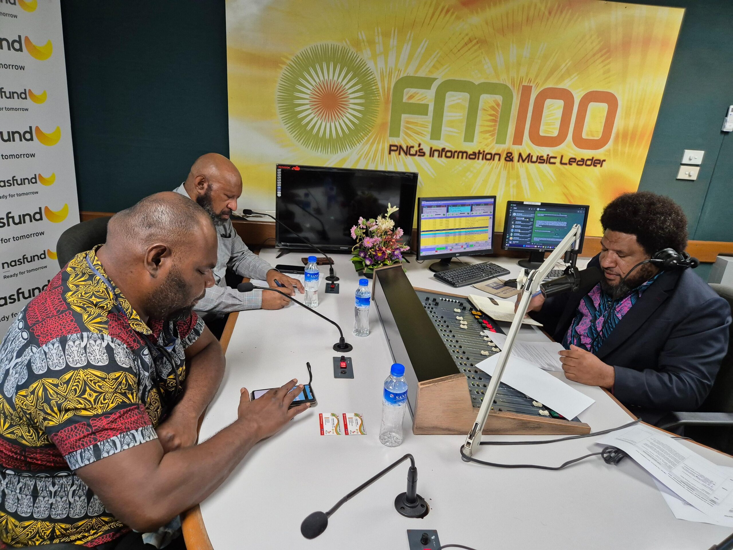 Policy and Porgrams Director, George Kauli seated far left and Mr. Christopher Tabel, Advisor Special Projects on air with talkshow host, Culligan Tanda.